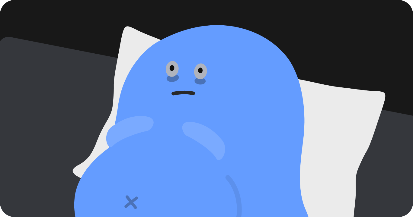 夜、ベッドで横になったまま眠れずにいる妊婦