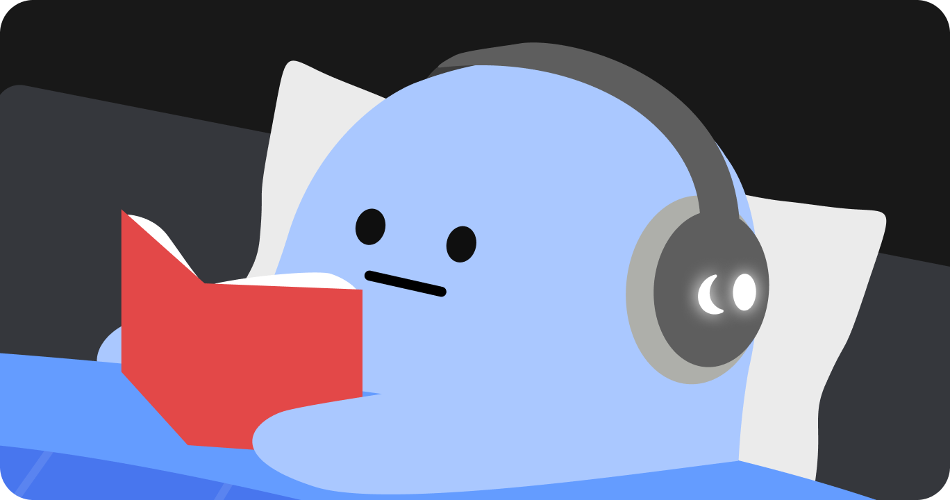 寝る前にベッドでくつろぎながら読書をしている人