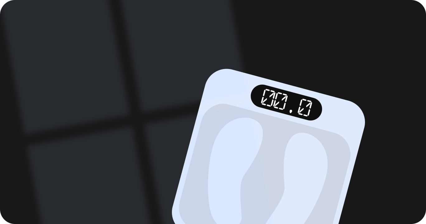 暗い部屋に置かれた体重計