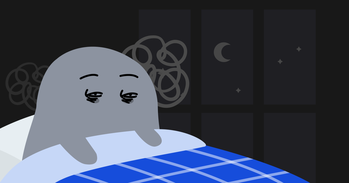 不眠症で眠れずに苦しんでいる人の様子