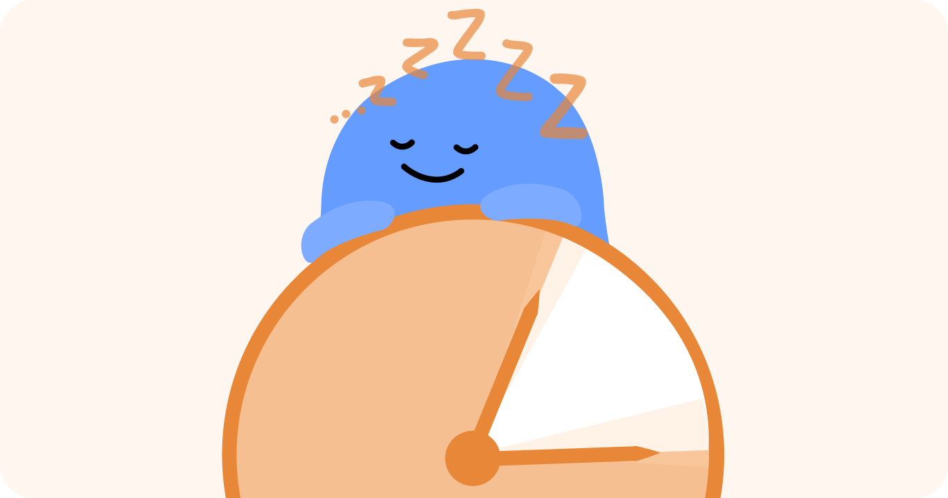 正午を示す時計のそばで昼寝をしている様子